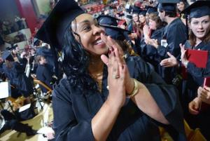 Graduation day at YSU A student in a cap and gown.