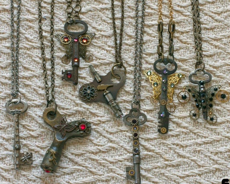 Key necklaces with flowers and butterfly wings designed onto the key