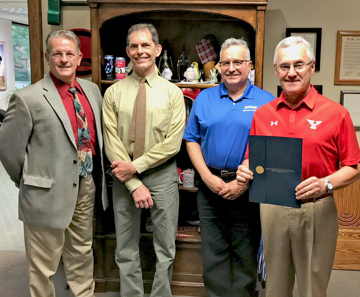 Pictured from the left are Jeffrey Oprean of FirstEnergy Generation LLC, Human Resources.; Dan Coyne, coordinator of the YSU Power Plant Technologies Program; Bob Lampson of FirstEnergy Service Co., Fossil Workforce Development; and YSU President Jim Tressel.