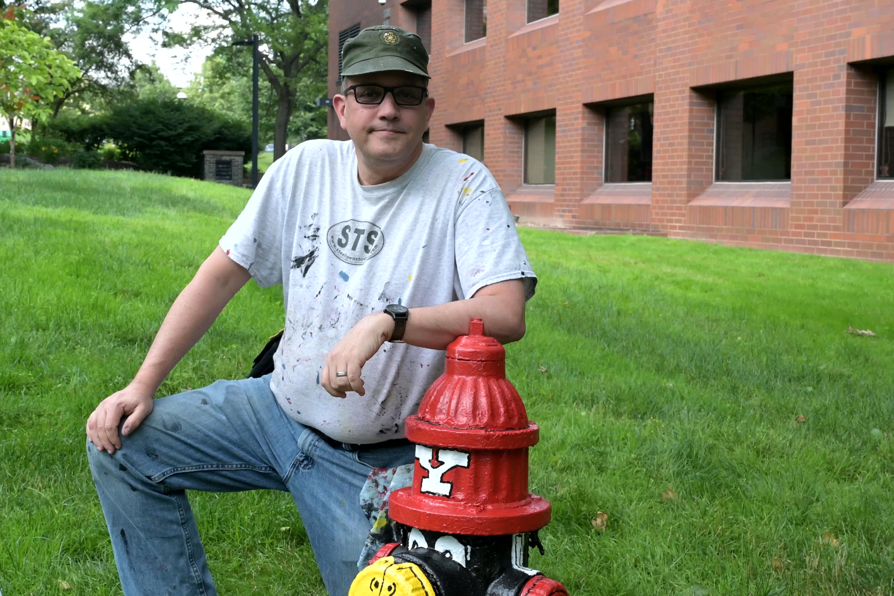 Bob Barko posing in front of one of the Pete fire hydrants on campus