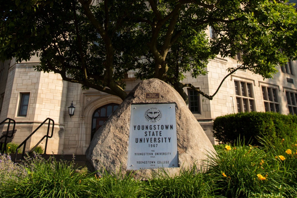 A picture of the rock outside of Jones Hall with the YSU Presidential Seal on it