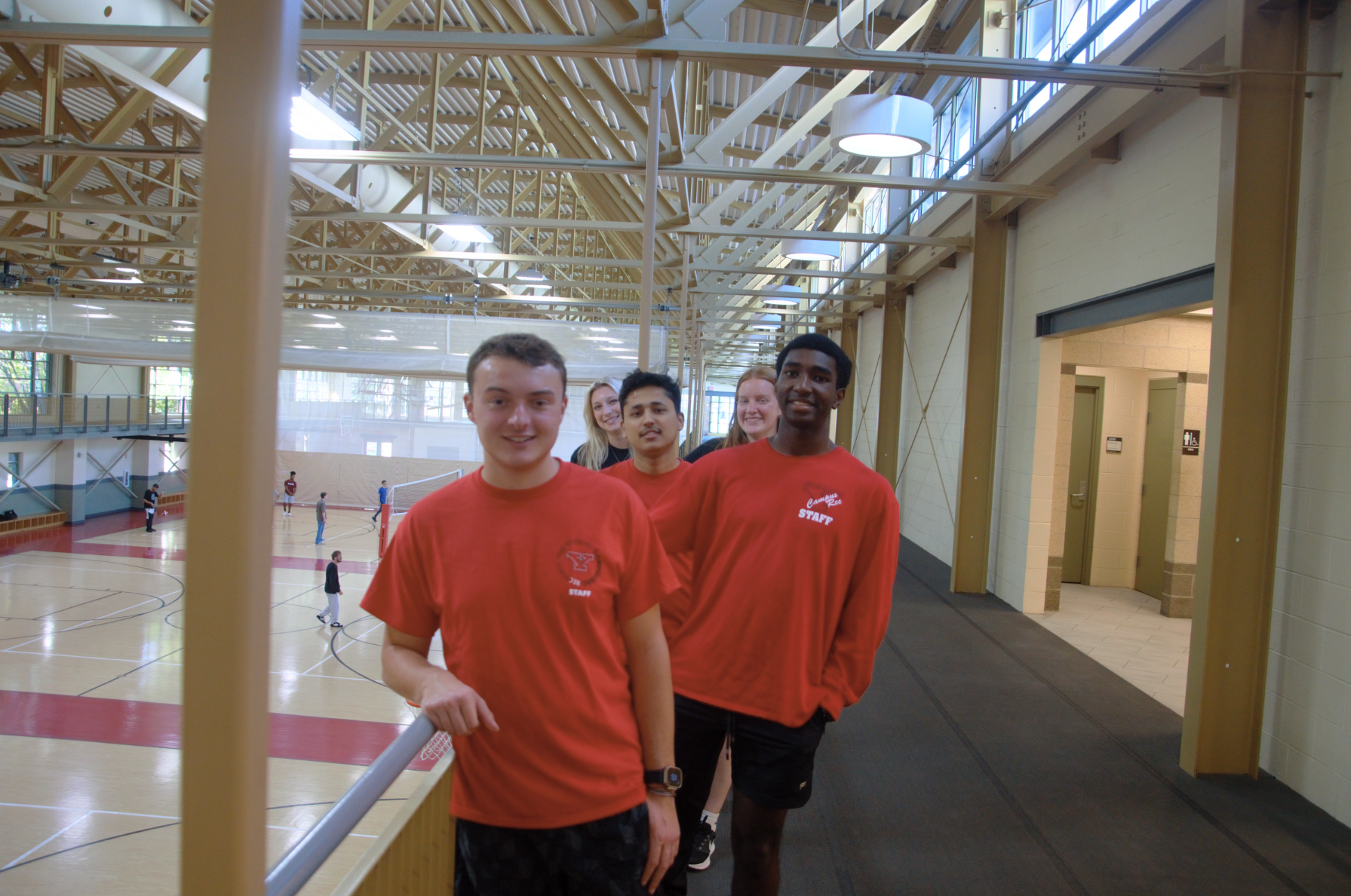 5 Campus Rec Student Staff lined up on the track