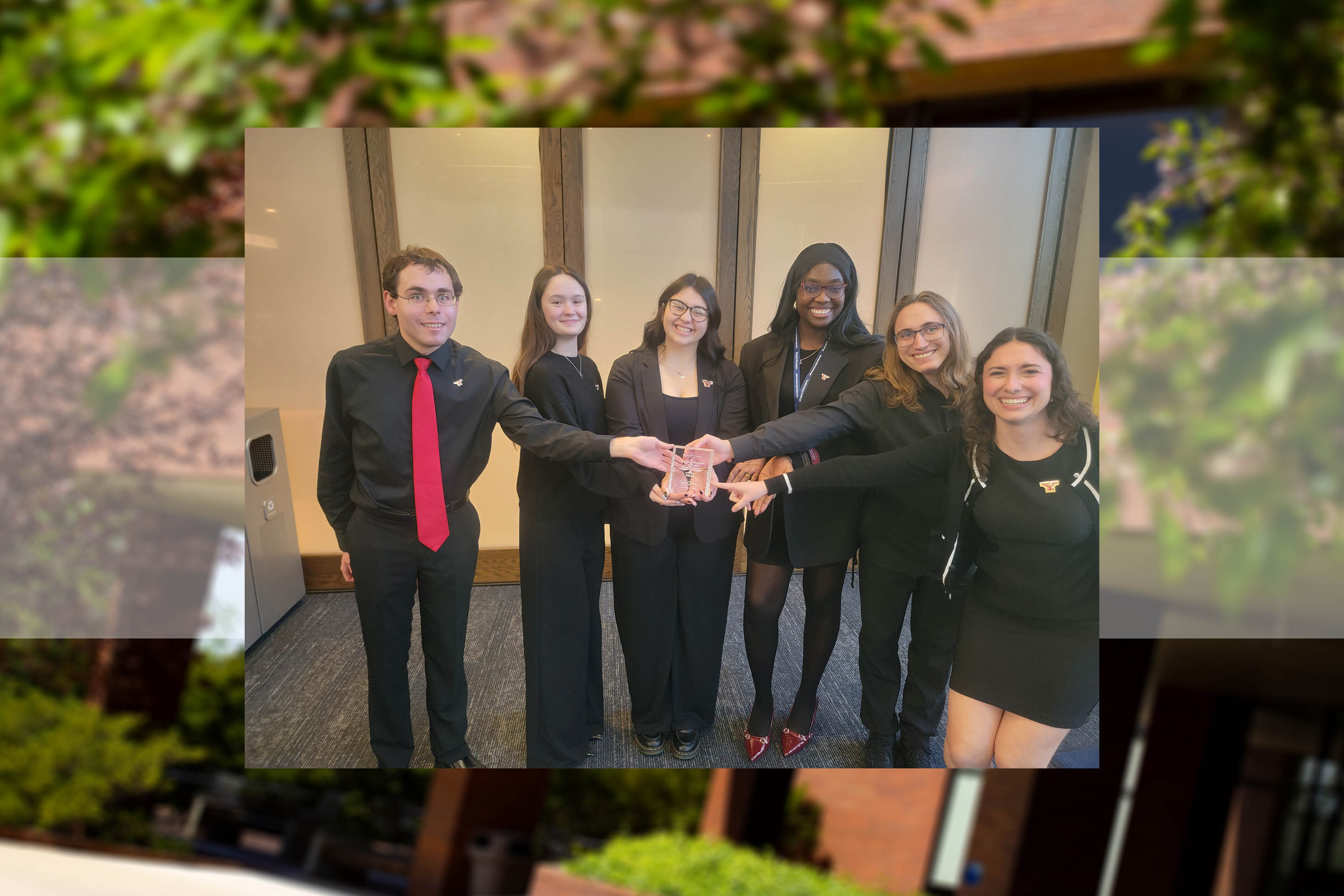 Members of YSU's Ethics Bowl team preparing for the regional competition