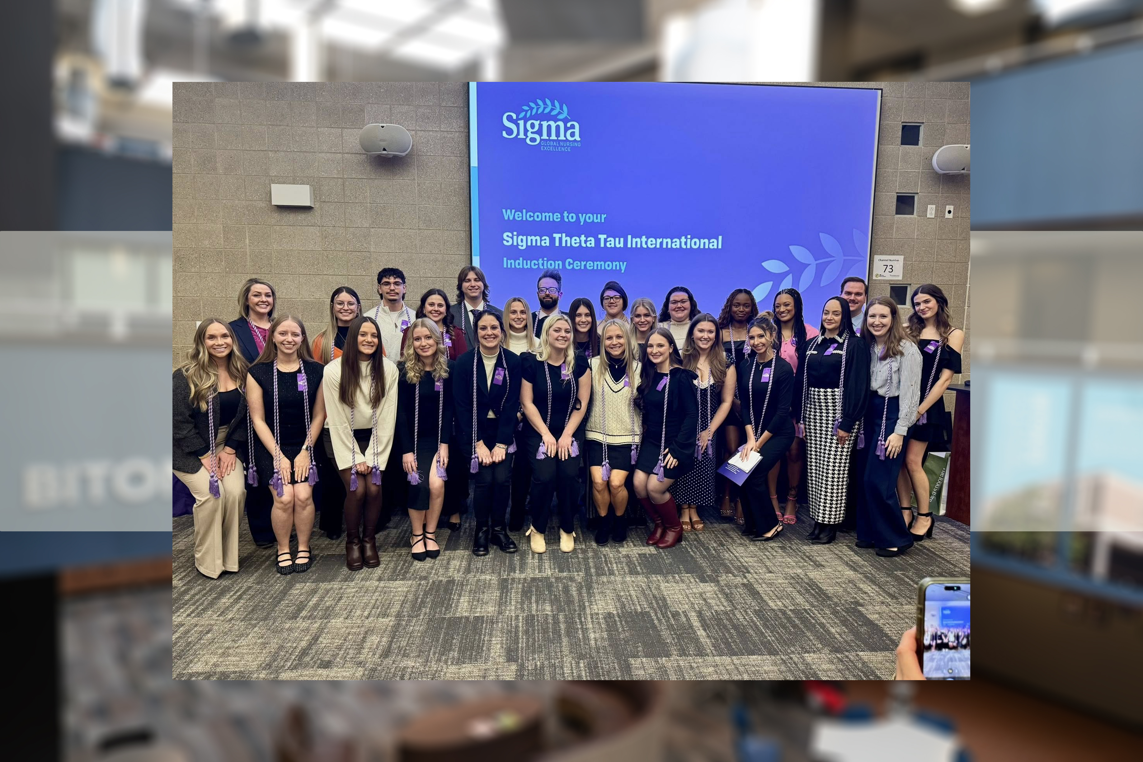 Newly inducted members of Centofanti School of Nursing's Xi Xi Chapter of Sigma, the International Honor Society of Nursing pose for a group photo with their honor cords