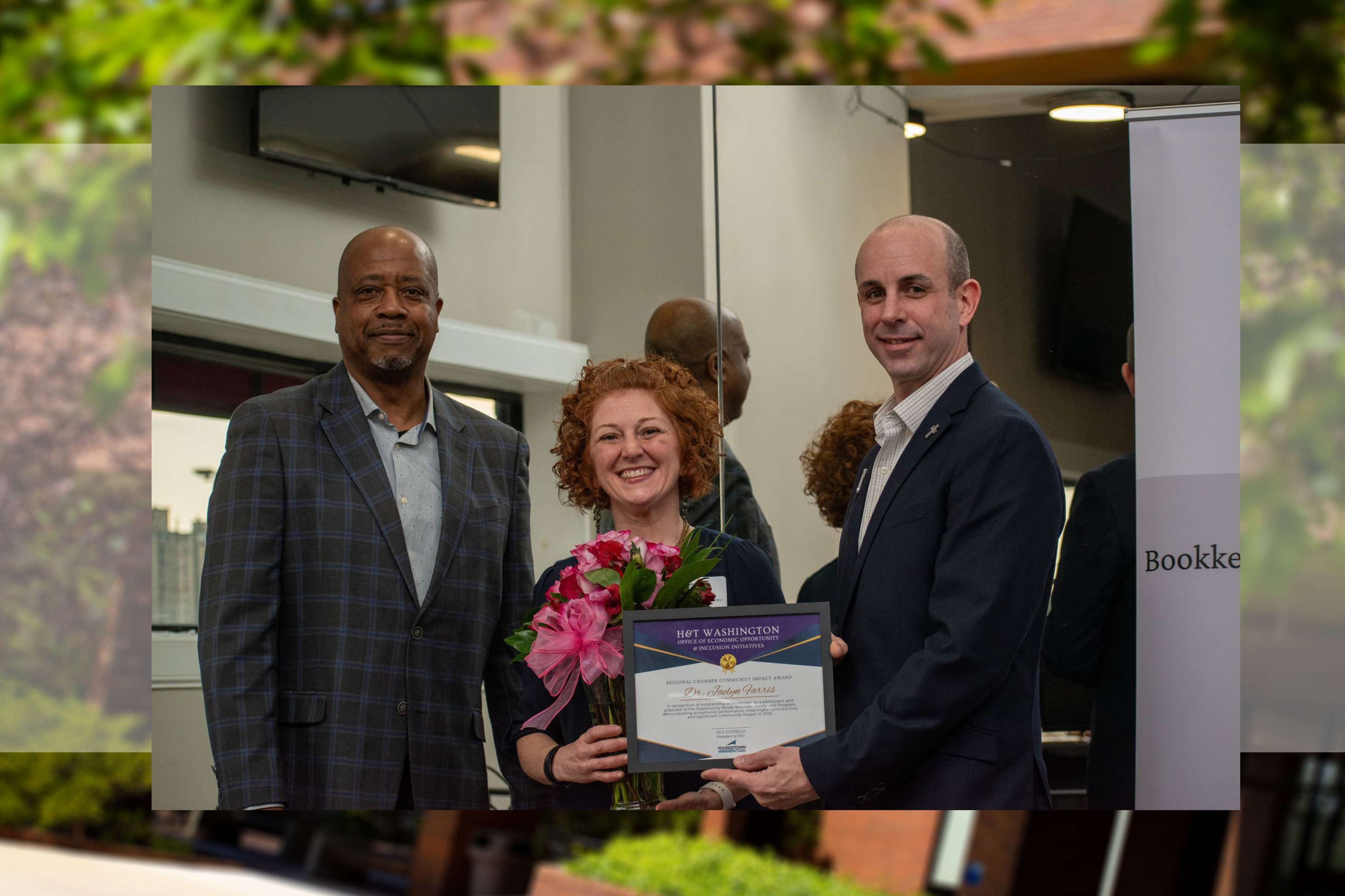 Jaelyn Farris receiving the Community Impact Award from the Youngstown/Warren Regional Chamber