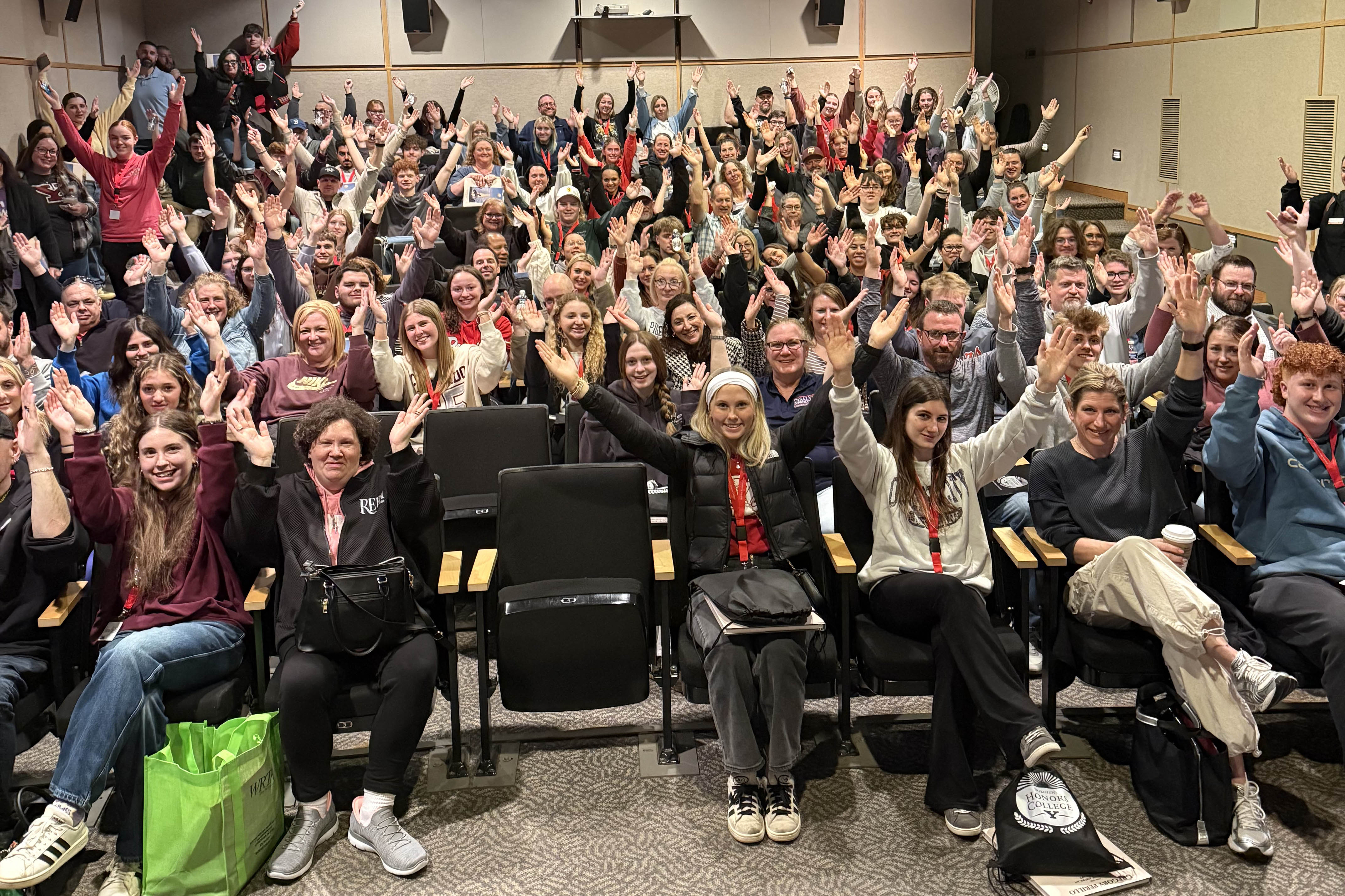 New Honors students pose during orientation making the YSU Y with their arms