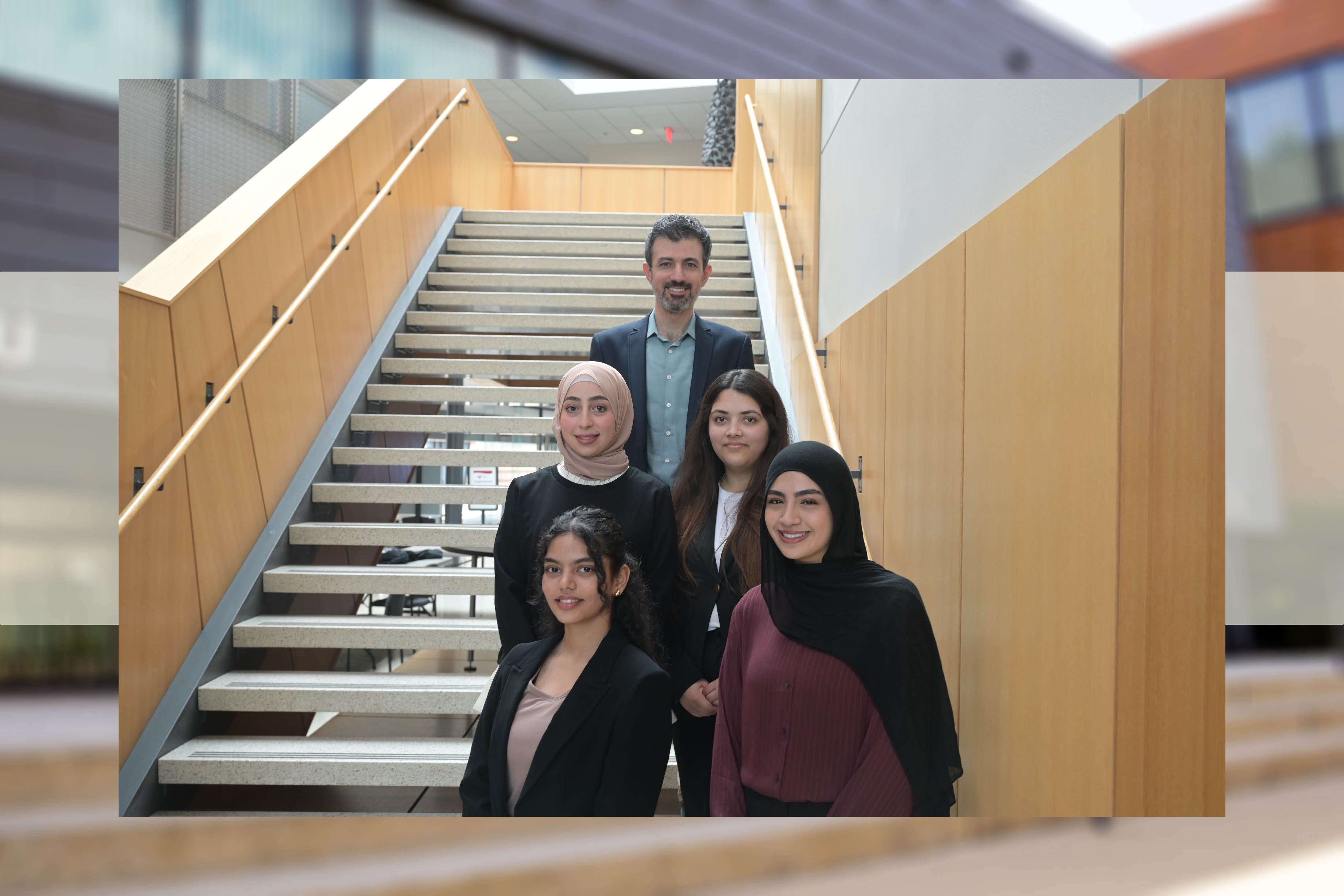 Omer Genc, Akriti Parajuli, Tanishka Agnihotri, Aleen Kanan and Lojein Yacoub pose on the steps in Williamson Hall