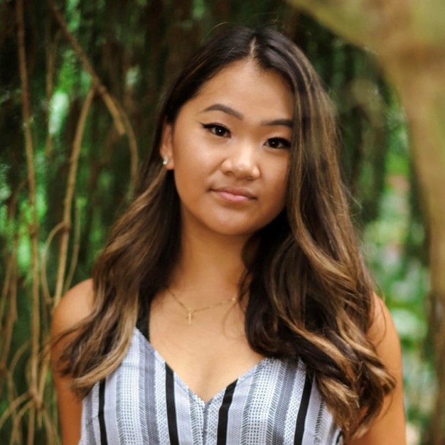 Photo of Emily Vo in front of a tree