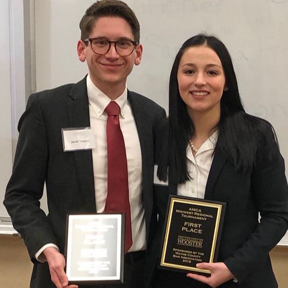 Michael Factor and Samantha Fritz showing awards