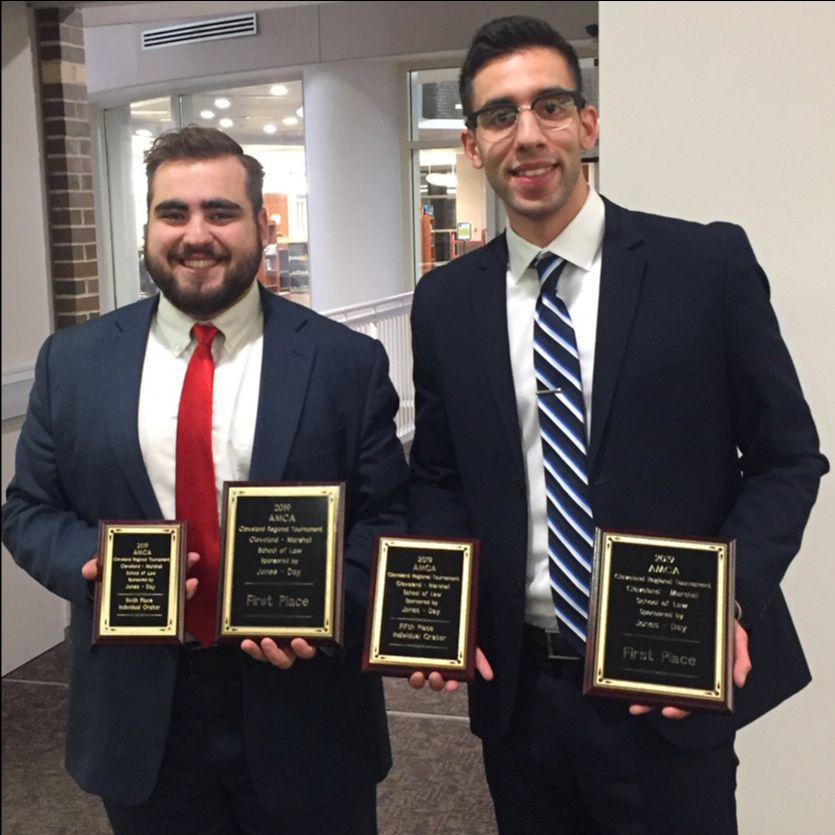 Jacob Tomory and Moataz Abdelrasoul showing awards