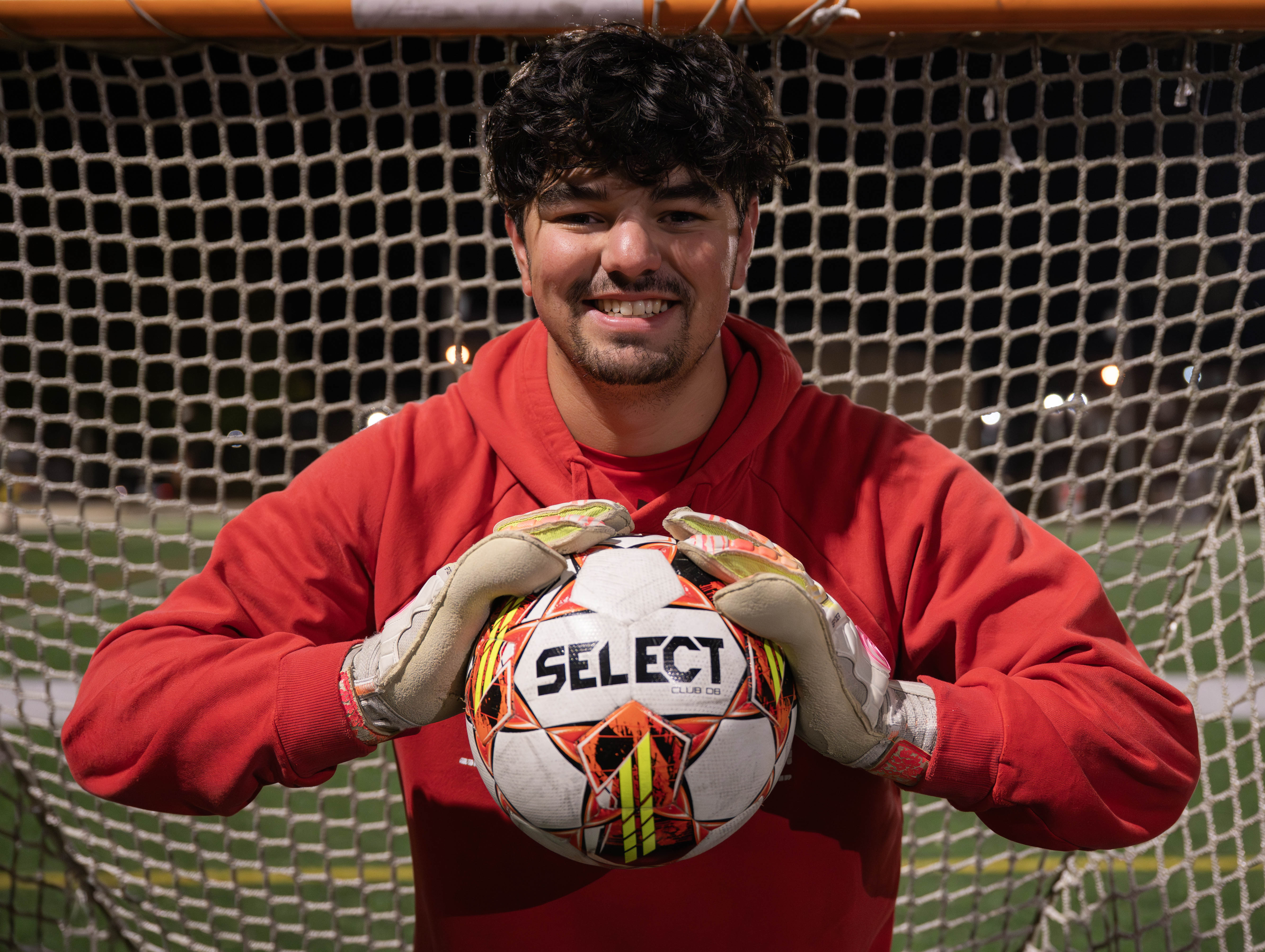 Connor Wallace posing with a soccer ball