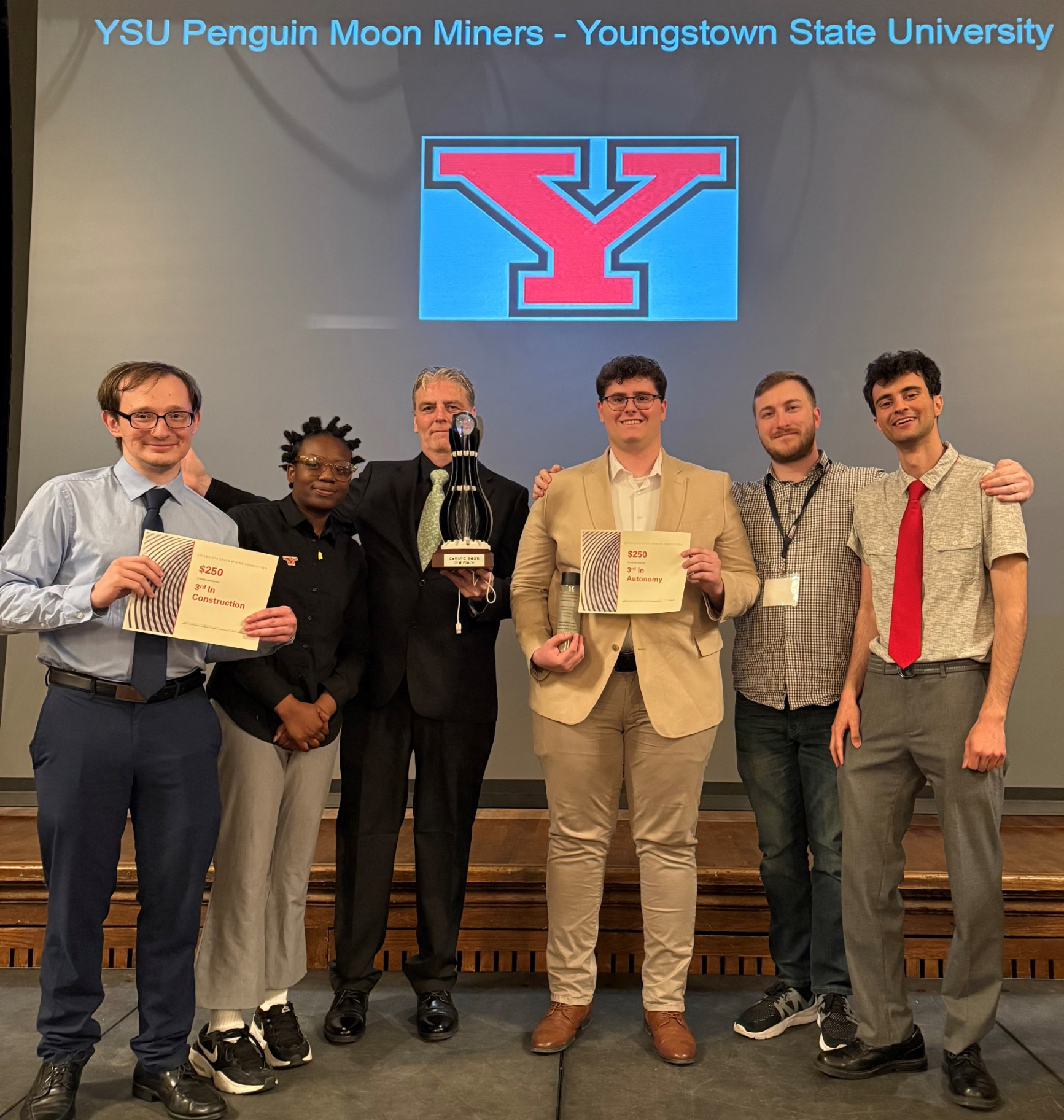 YSU's Lunabotics team with their awards and 3rd place trophy