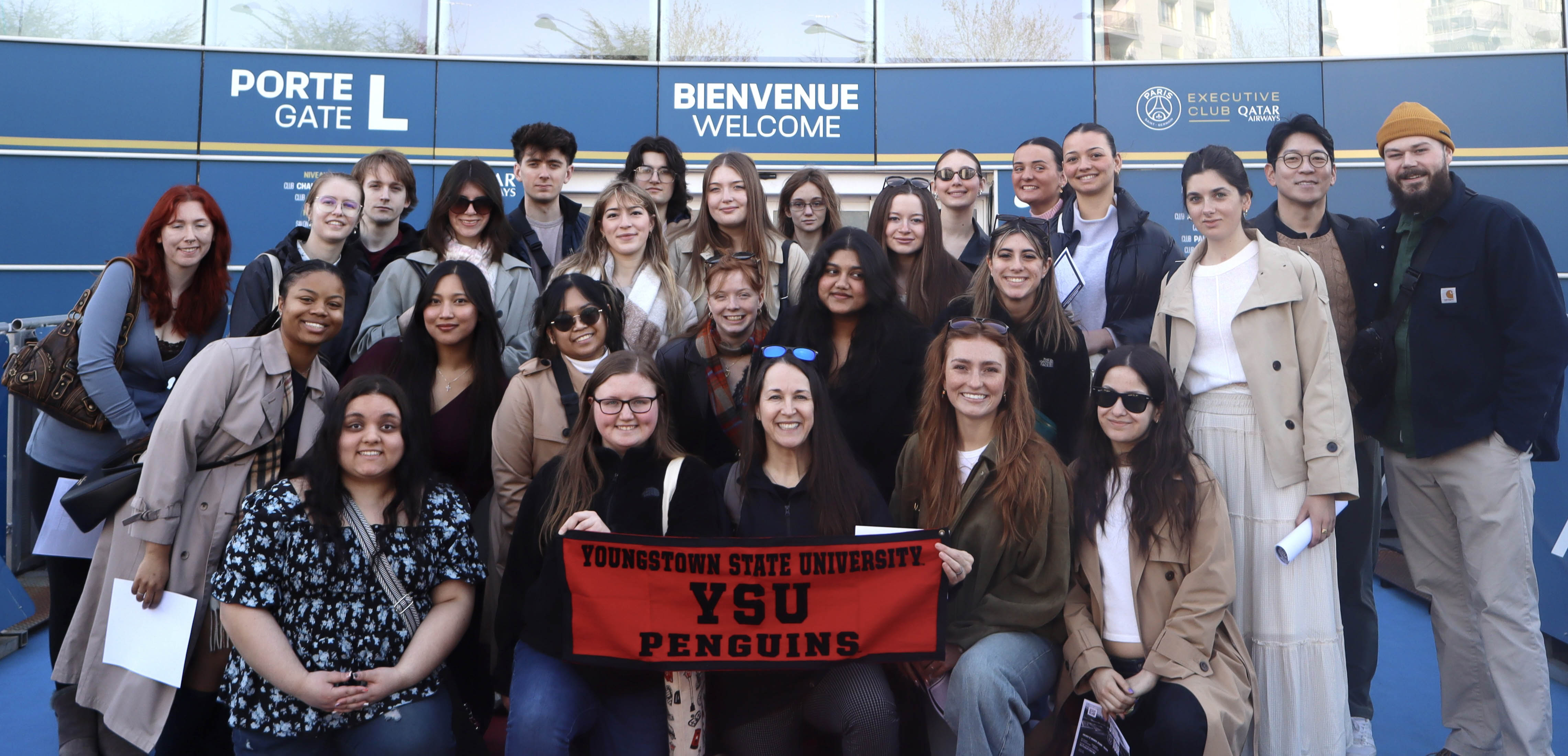 Students and faculty from Williamson College of Business Administration’s IB Field Study Tour LDN Paris class pose outside of PSG Stadium in Paris