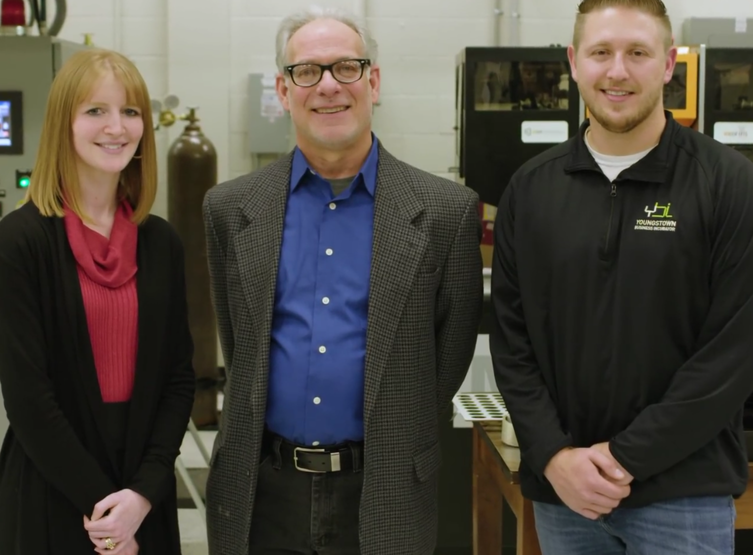 Martin Cala, center, professor of Industrial Systems Engineering, with former students, Ashley Totin and Zac Divencenzo, are featured in the "Rethinking Manufacturing" video.