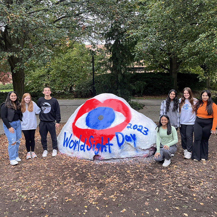 Students for Sight paint the rock on campus
