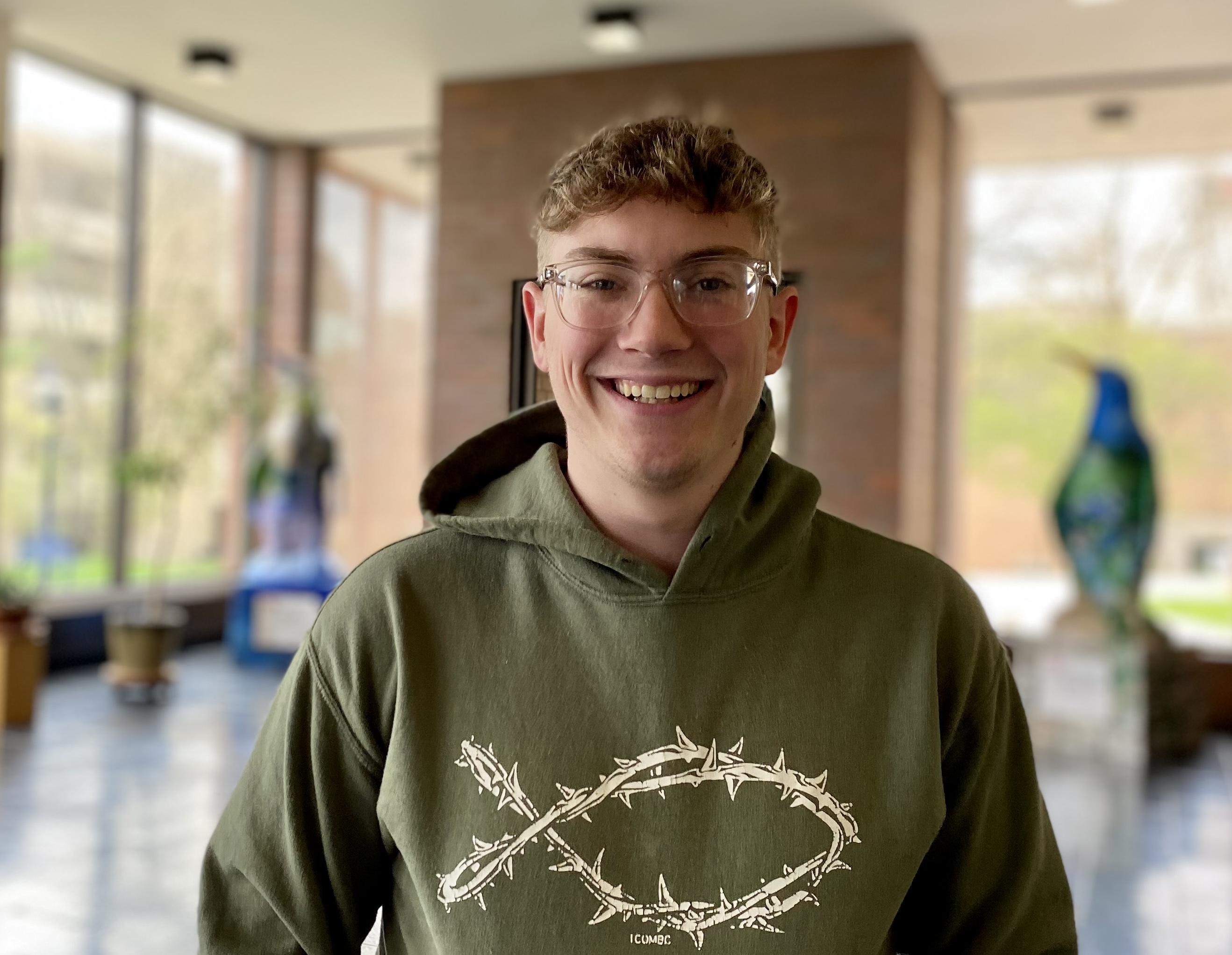 Nathan Mitchell poses in the lobby of Tod Hall