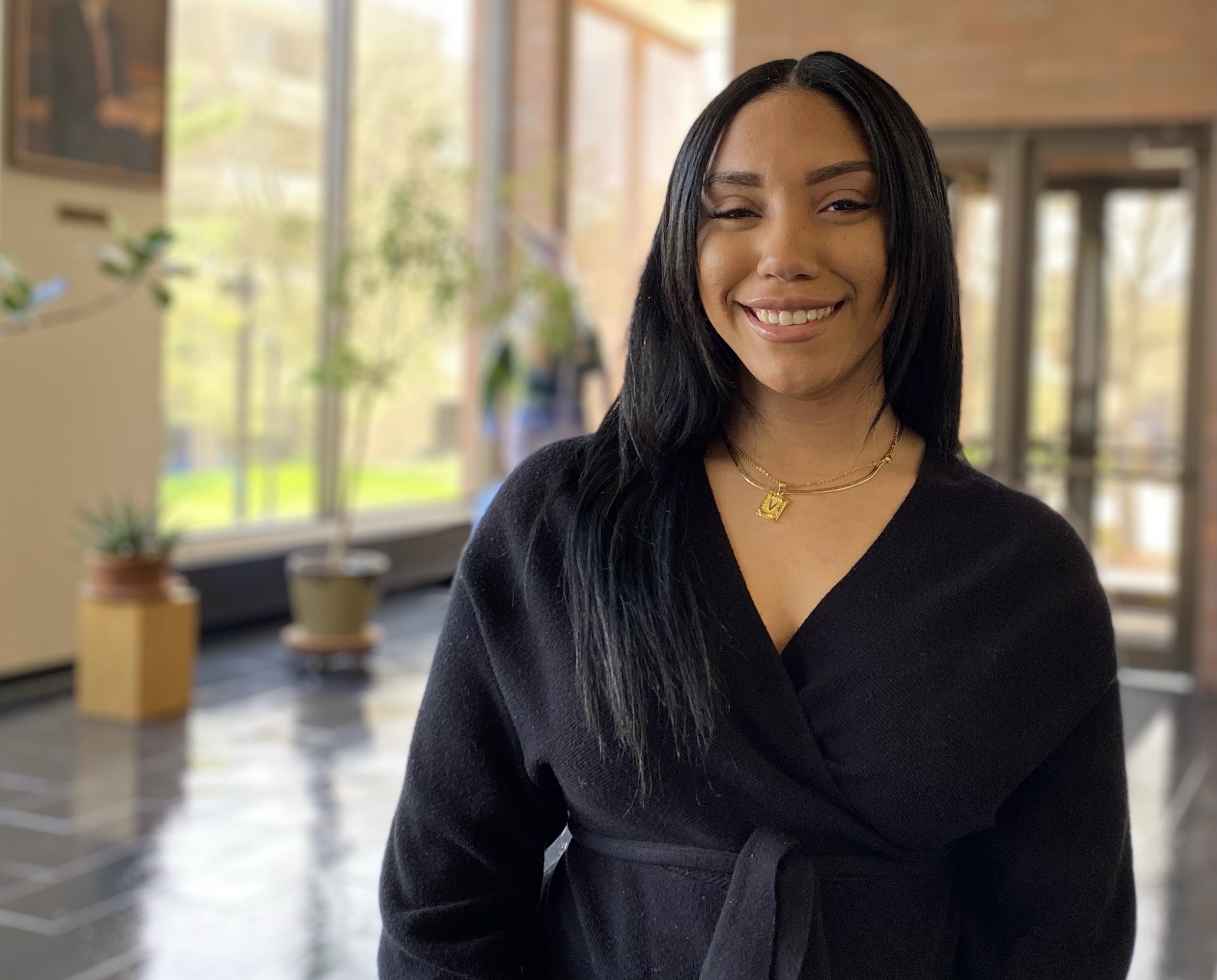 Vajanae Turner posing in the lobby of Tod Hall