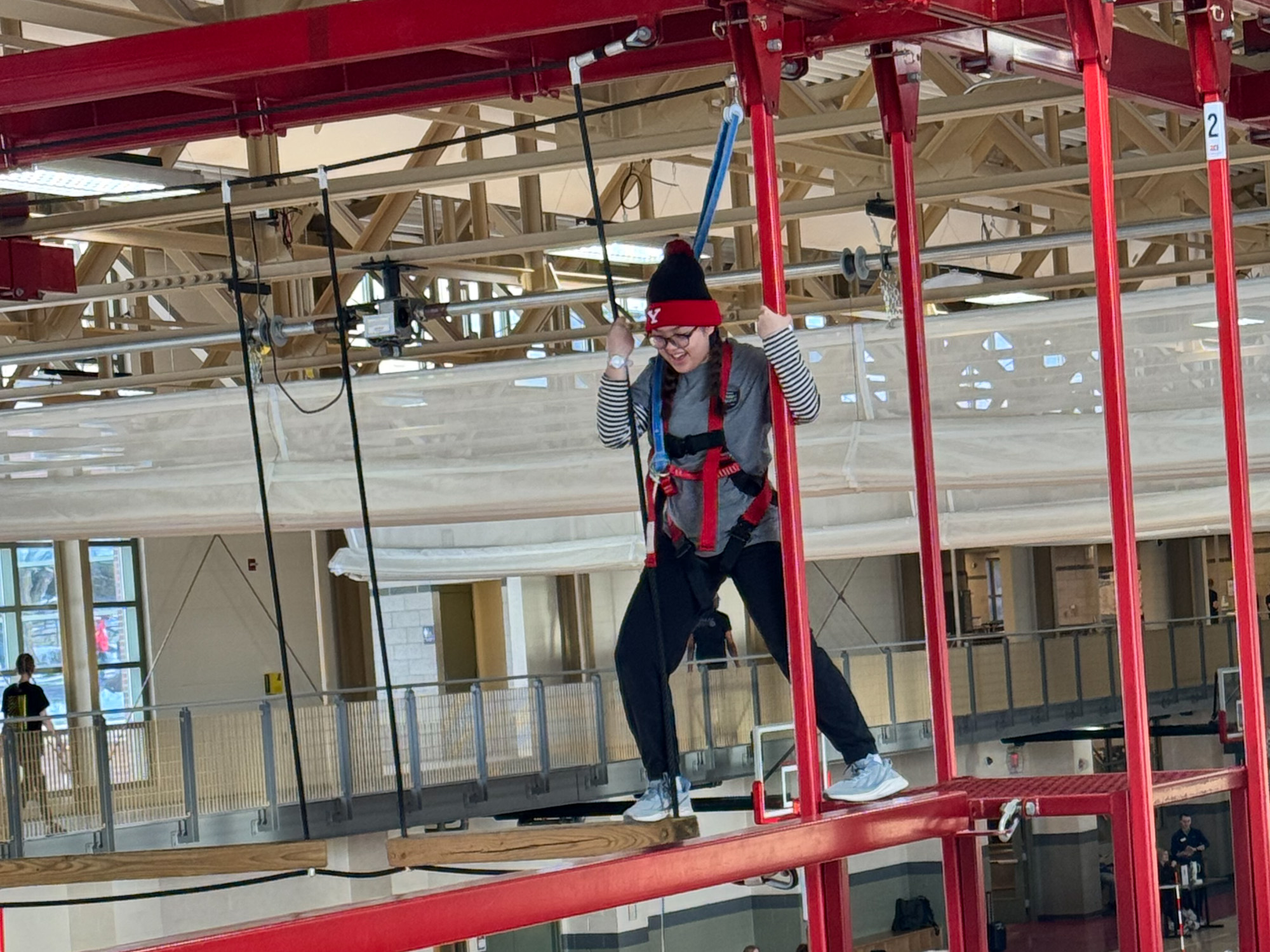 students using elevated wlakway during adventure rec activity