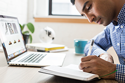 man working at laptop