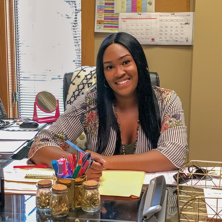 Alumna Jessica Williams at her desk