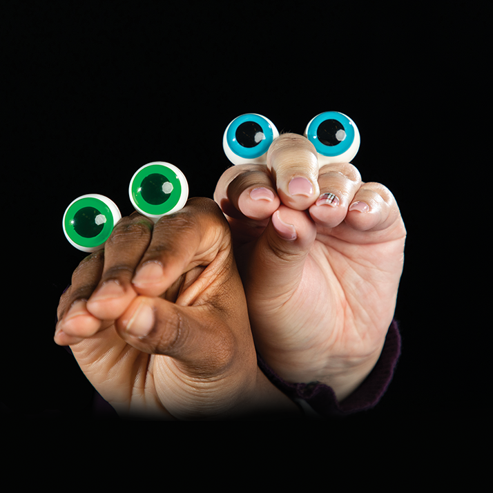 Two hands with peepers puppet eyes