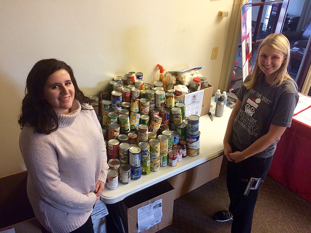 Students participating in the college canned good drive 