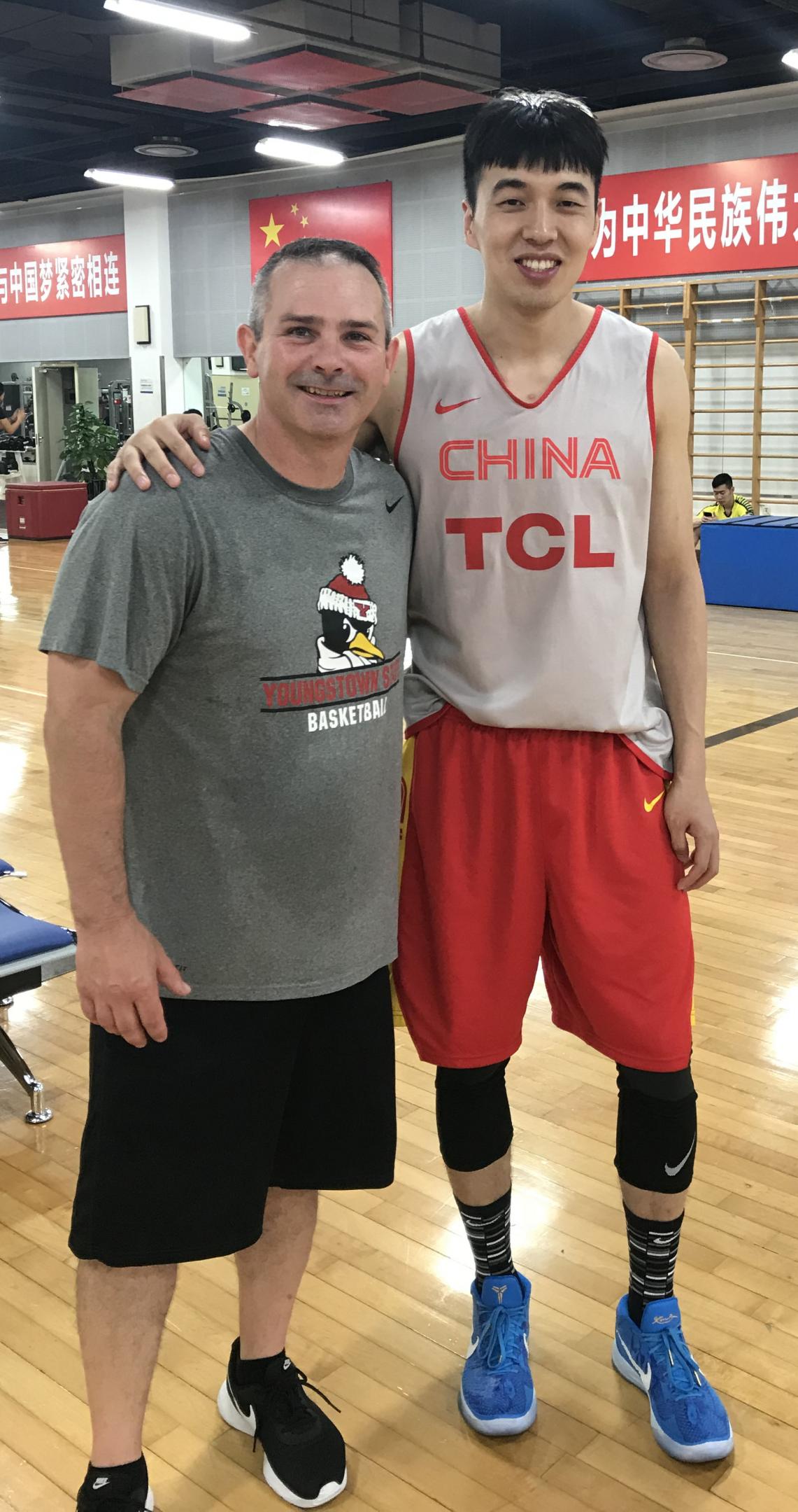 Todd Burkey with Zeng Lingxu of the Chinese national basketball team at the Chinese Olympic Training Center in Beijing.