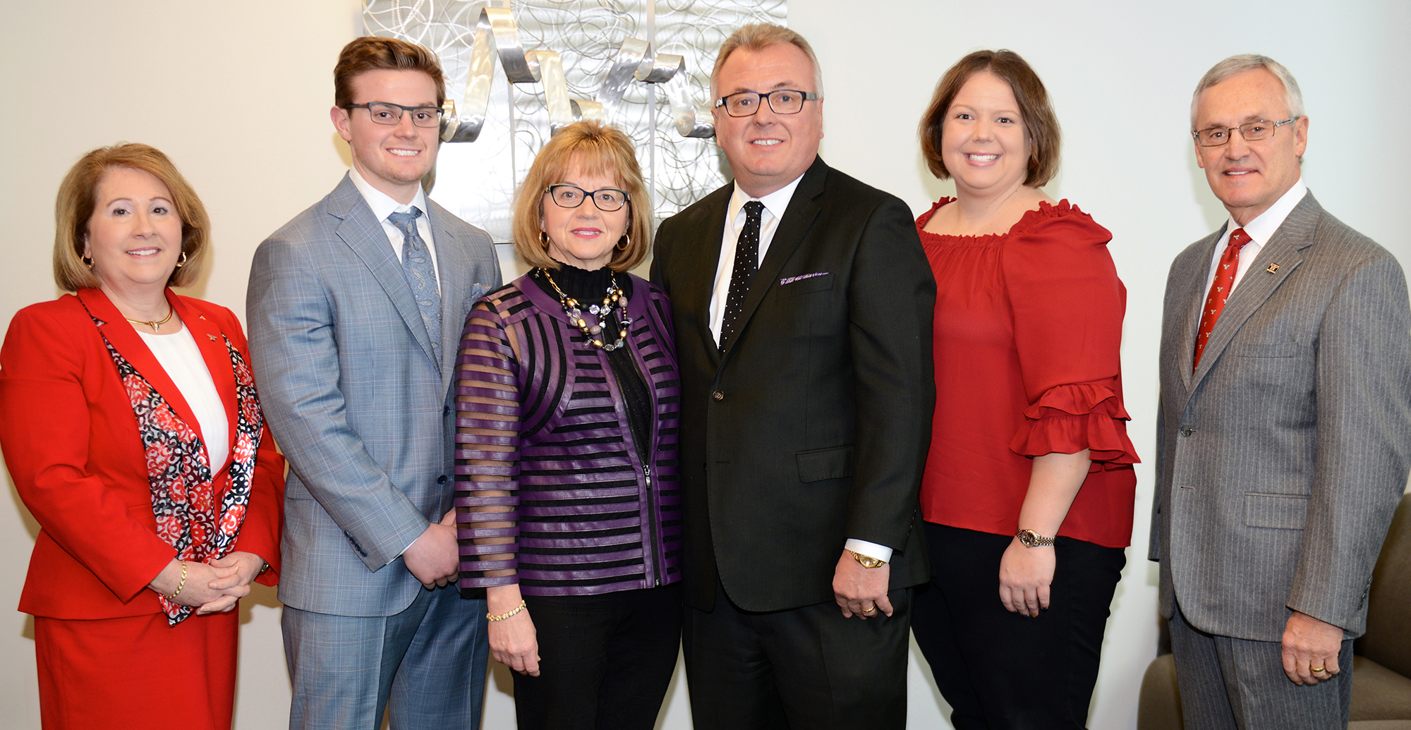 From the left are Betty Jo Licata, dean of the YSU Williamson College of Business Administration; members of the Mrozek family - Matthew, Wanda, Garry and Stephanie; and YSU President Jim Tressel