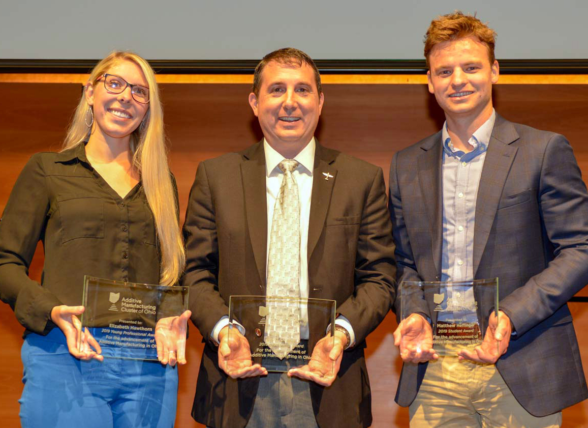 From the left, YSU graduate Emily Hawthorn, faculty member Brett Conner and current student Matthew Heffinger, with their awards from the Ohio Additive Manufacturing Cluster. 