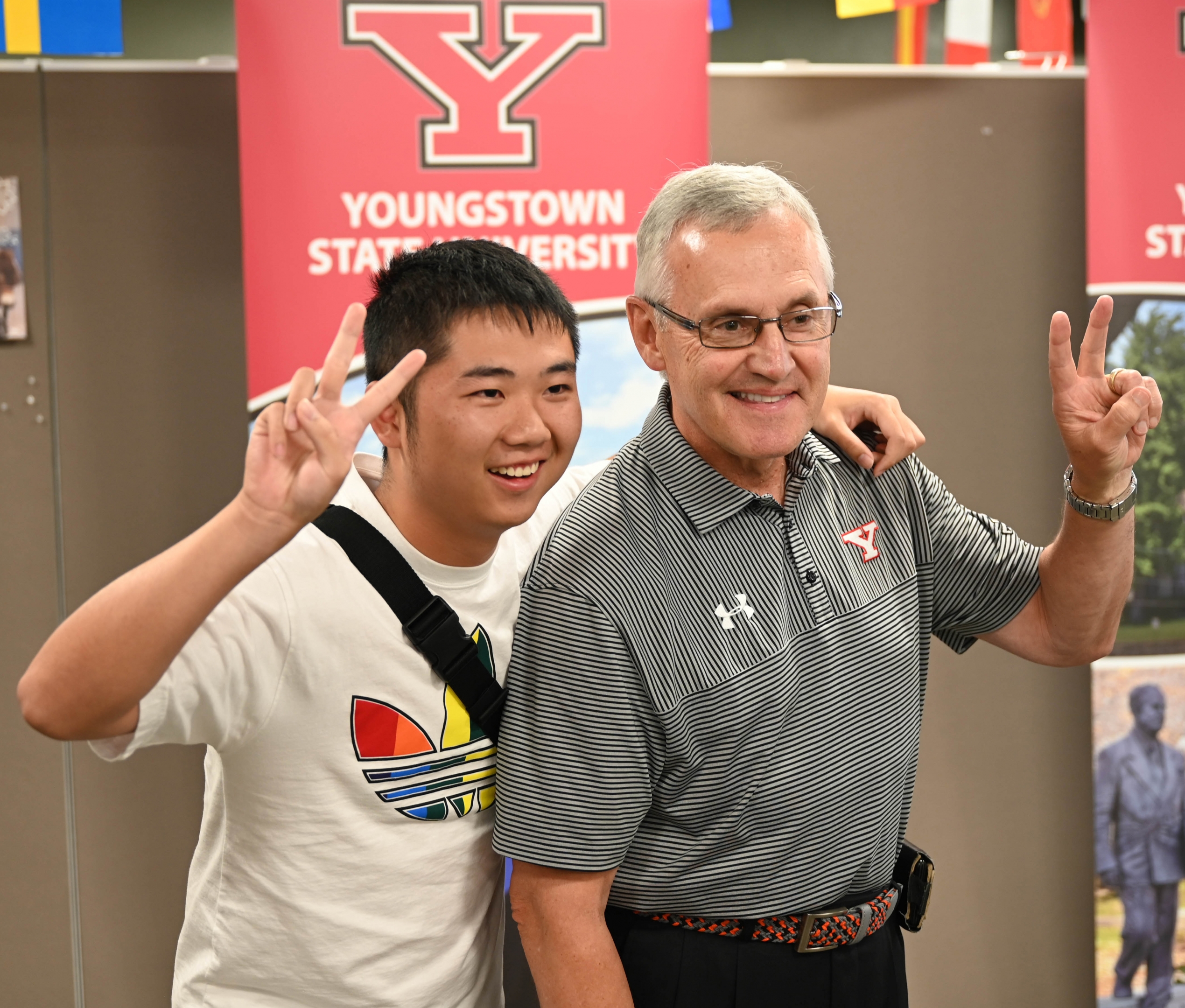 President Jim Tressel and a student in the Summer in America program pose for a photo during the concluding event of the program last week in Jones Hall