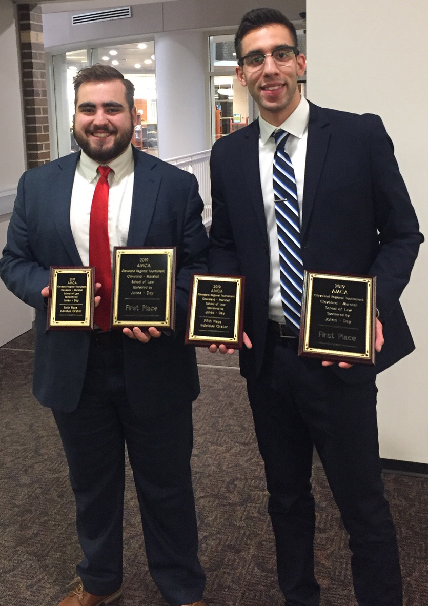 Michael Factor, left, and Moataz Abdelrasoul after winning the Cleveland Marshall Regional Moot Court Tournament.