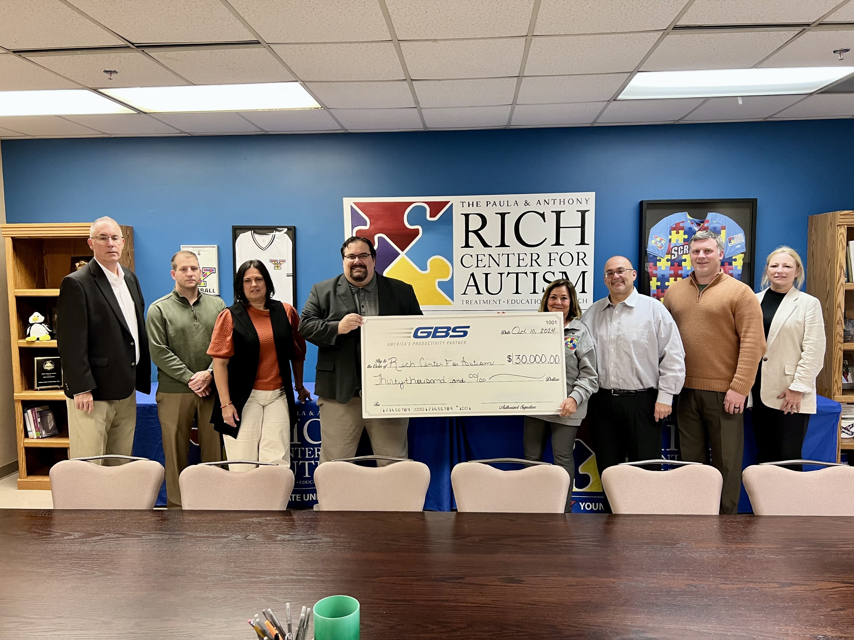 Representatives from GBS visited The Rich Center with a $30,000 donation check