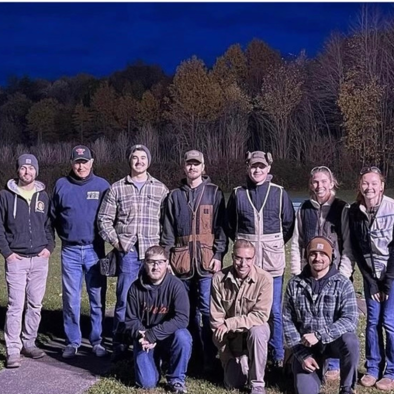 Trap Shooting club standing for picture wearing camo