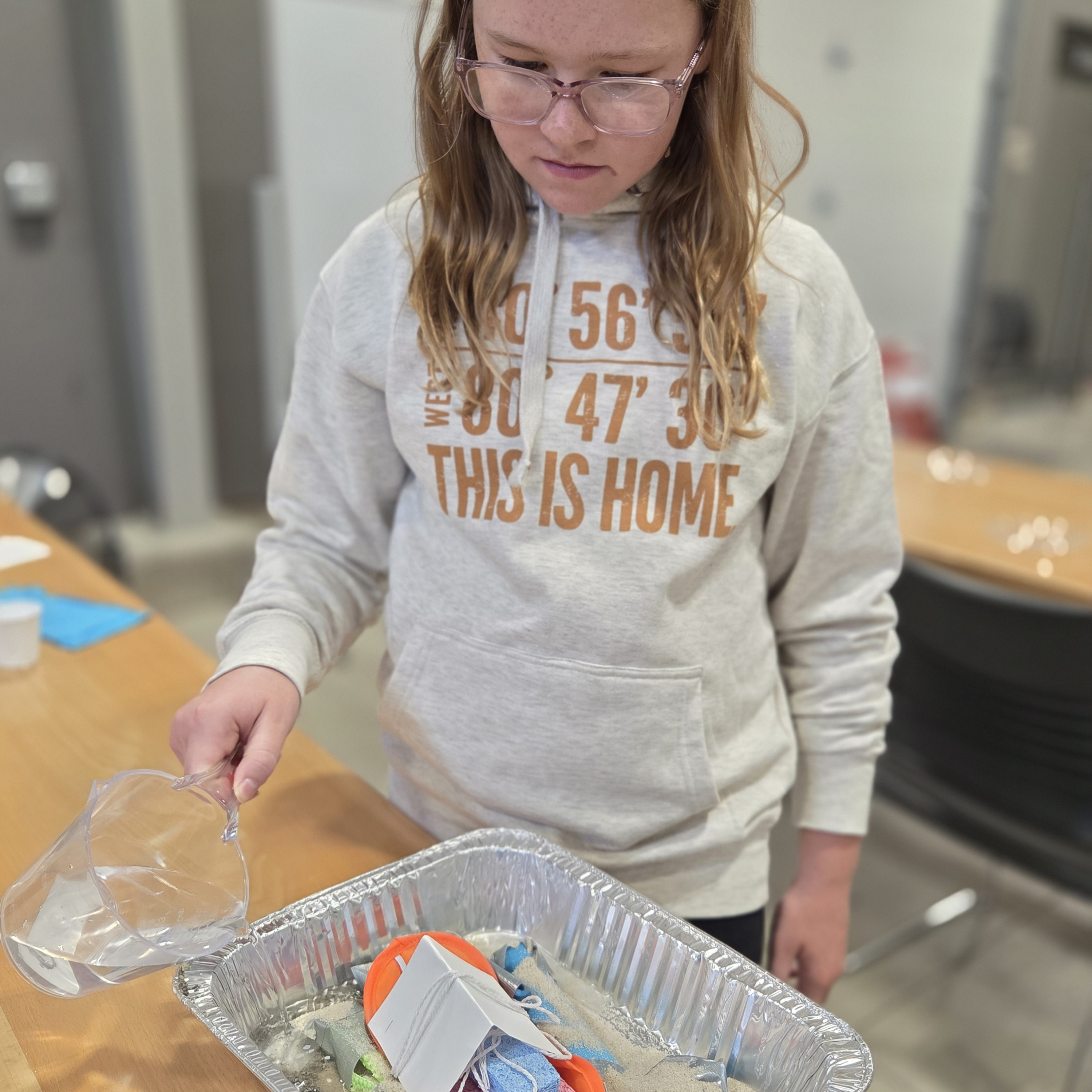 Young girl builds floating camp site