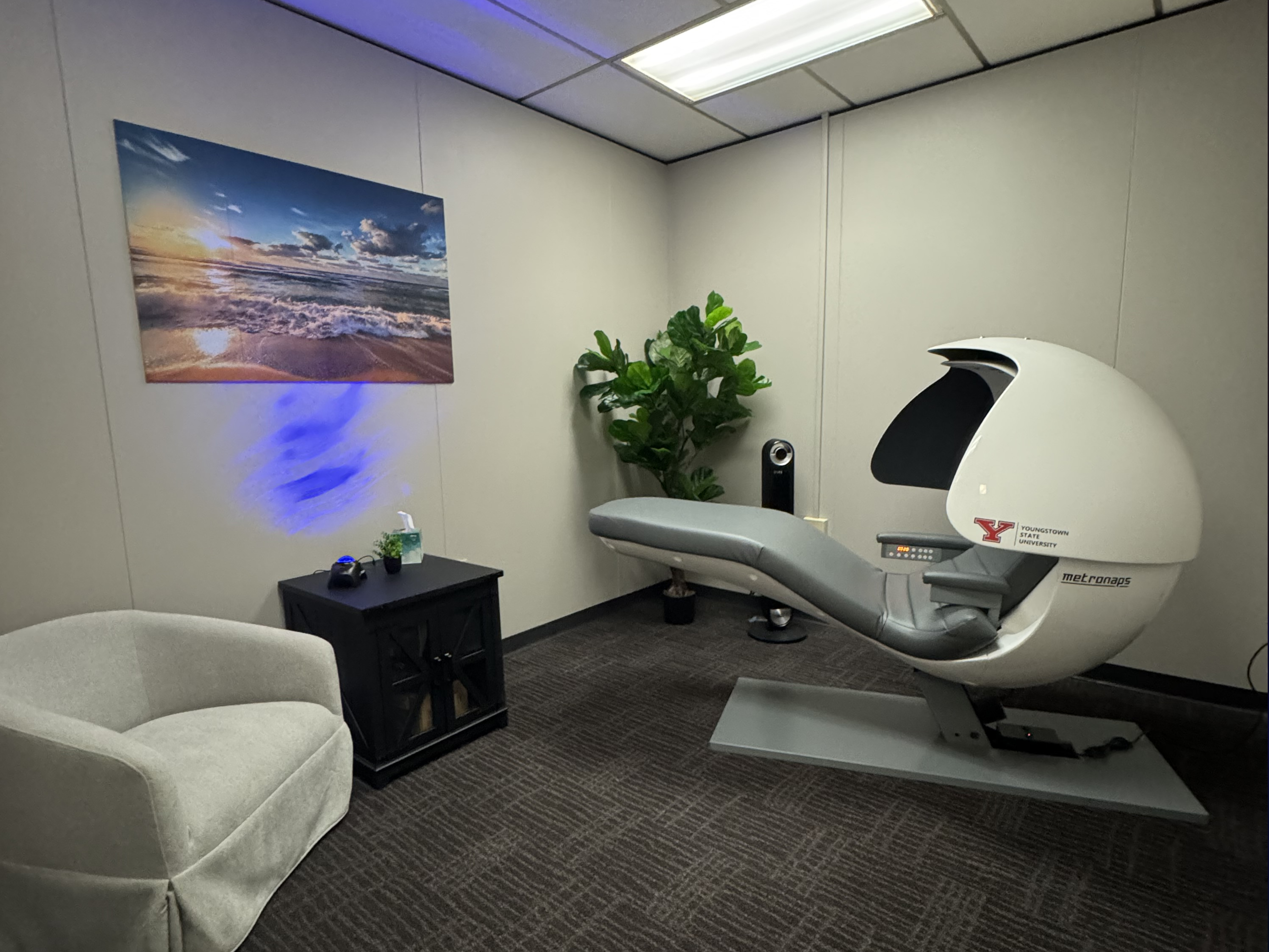 nap pod in room with purple light