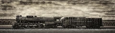 A sepia colored photograph of a train with the words Chesapeake & Ohio and 2700 painted on the sides