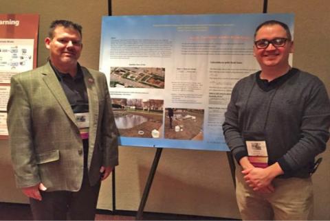 Associate Professor Robert J. Korenic, right, and Joseph Sanson, assistant professor, with their research poster at the American Society of Engineering Education Conference for Industry and Education Collaboration.