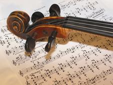 a violin over sheet music