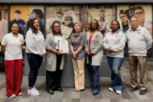 Guin Fit staff pose with the certificate from the city of Youngstown