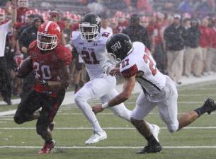 Junior tailback Jody Webb runs through the raindrops at Saturday's contest against St. Francis (Pa.)