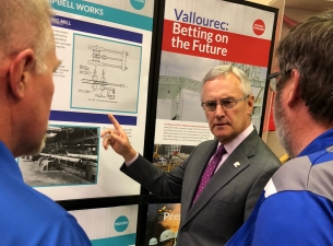 SU President Jim Tressel talks with employees of Vallourec at the new exhibit at the Youngstown Hist