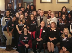 Flor "Shorty" and Elba Navarro, seated front, are pictured with YSU President Jim and Ellen Tressel 