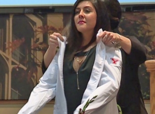 YSU Sophomores receiving their white coats during a ceremony 