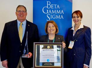 William Vendemia, left, professor of Management, received the international Beta Gamma Sigma Chapter