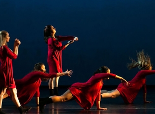 Members of the YSU Dance Ensemble practicing a routine on stage