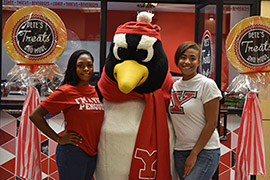 2 female students with Pete, at Pete's Treats and More