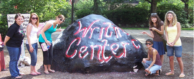 Students painting the rock
